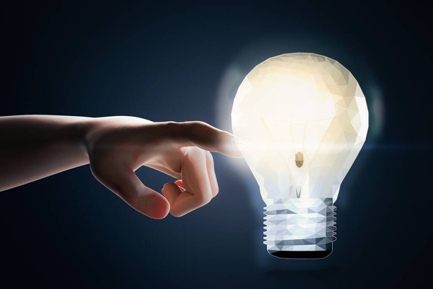 Bright idea concept with 3d rendering human hand point at  shiny light bulb graphic display - Foto, afbeelding