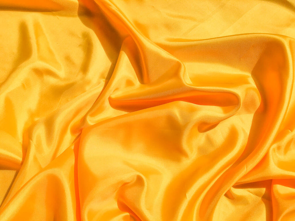 Minimal yellow fabric texture background. smooth elegant wavy light with cpoy space - Photo, Image