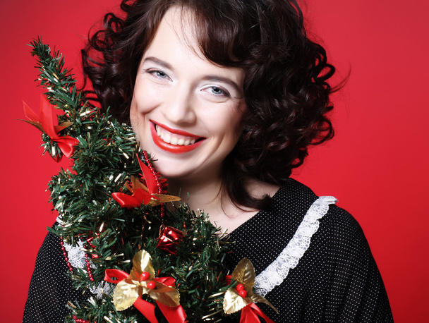 Woman holding Christmas tree - Zdjęcie, obraz