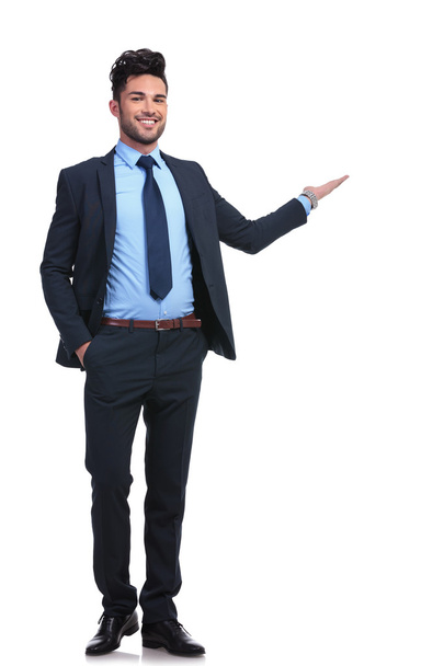 full body picture of a happy business man presenting - Photo, Image