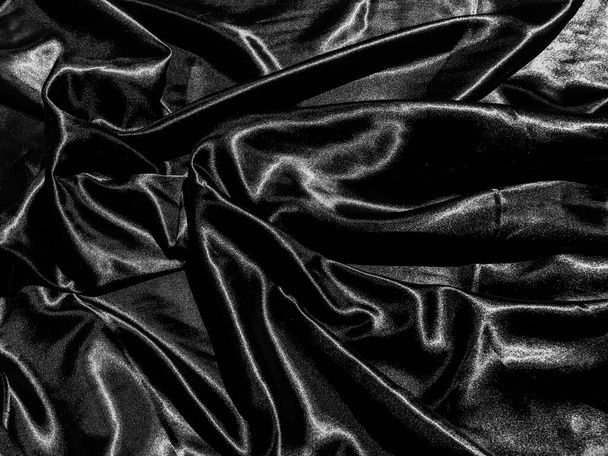 Fond de texture satinée noire avec onde liquide ou plis ondulés. Conception de papier peint
 - Photo, image