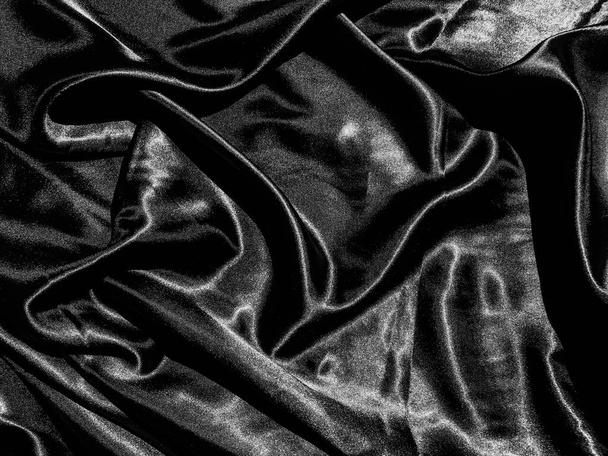 Zwarte doek of stof textuur achtergrond met vloeibare golf of golvende plooien. Behang ontwerp - Foto, afbeelding