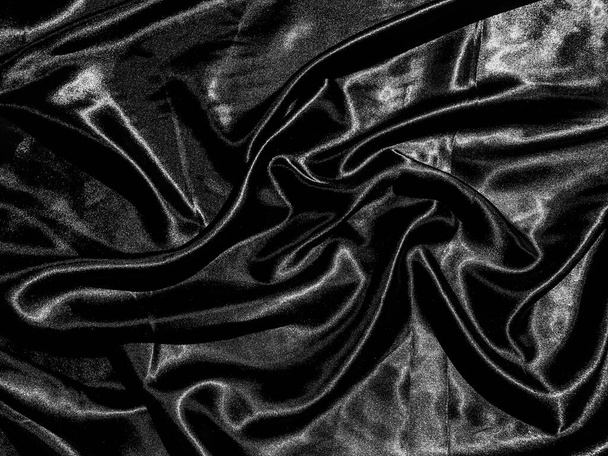 Fekete ruha vagy szövet textúra háttér folyékony hullám vagy hullámos redők. Tapétarajzolás - Fotó, kép