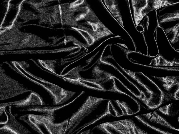 Černá tkanina nebo tkanina textura pozadí s tekutou vlnou nebo vlnité záhyby. Návrh tapety - Fotografie, Obrázek