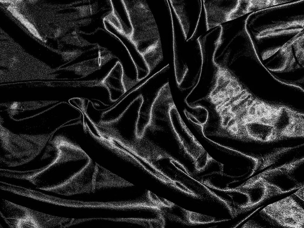 Чорна тканина або текстура тканини фон з рідкою хвилею або хвилястими складками. Дизайн шпалер
 - Фото, зображення