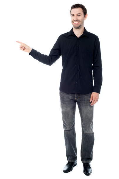 Stylish young guy pointing away - Foto, Imagem