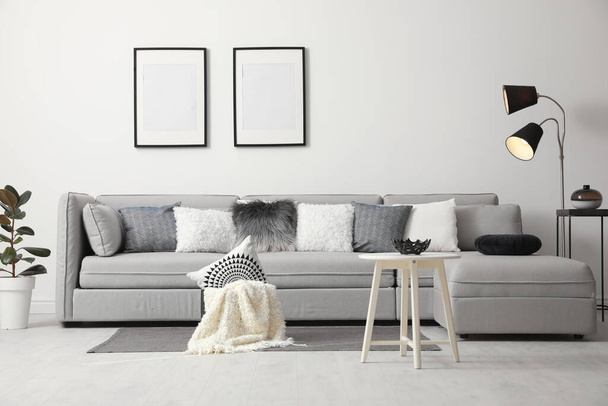 Stylish living room interior with comfortable sofa - Fotó, kép