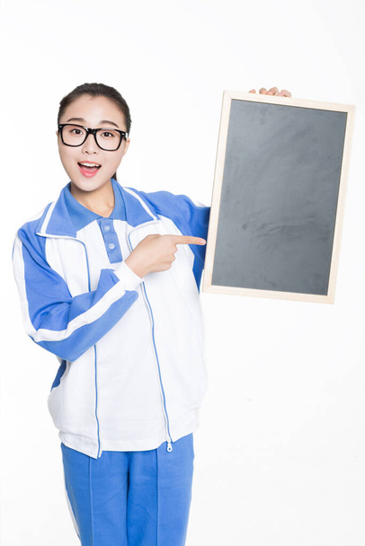 china beautiful female student black holding a message board - 写真・画像