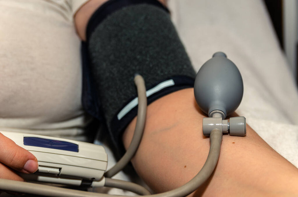 blood pressure measurement using a blood pressure monitor, close-up - Photo, Image