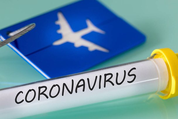Coronavirus. Virus vial, luggage tag and boarding pass. Concept. Financial problems of airlines due to the virus - Foto, immagini