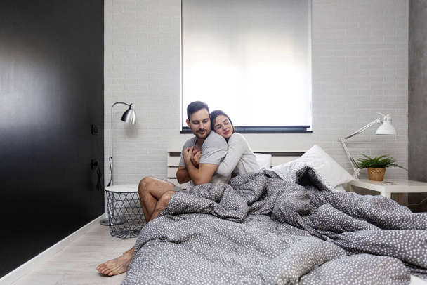Couple in bed early in the morning - Photo, Image