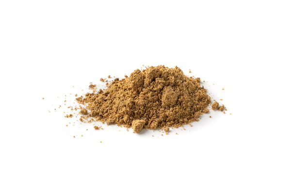 Pile of garam masala powder mix isolated. Ground spice mixes and blended herbs with fennel powder, ground peppercorns, cloves, cinnamon, mace, cardamom, curry, cumin, coriander - Photo, Image