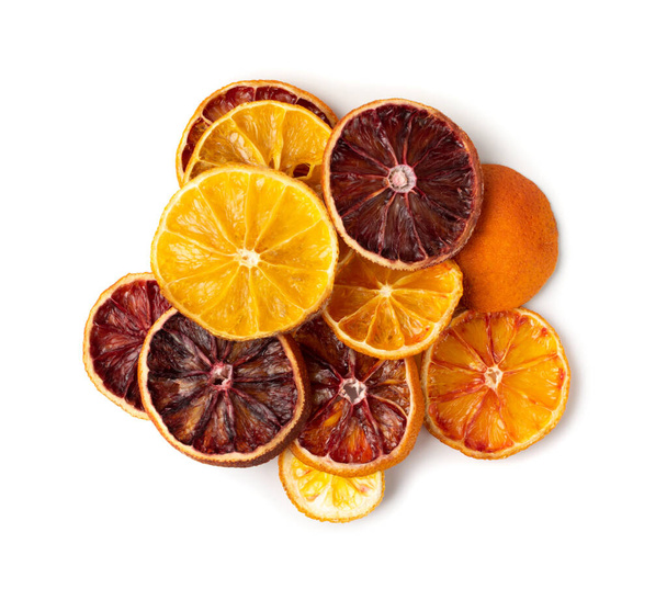 Dried slices of orange and blood orange isolated on white background. Dry lemon, tangerine and sicilian orange top view - Photo, Image
