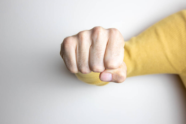 Mão com punho fechado como um sinal de conceito de força
. - Foto, Imagem