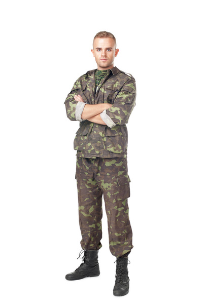Full length portrait of serious army soldier with his arms cross - 写真・画像