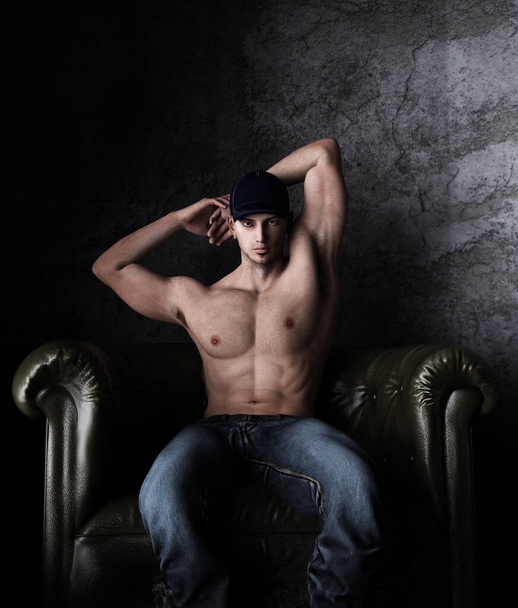 Sexy shirtless man sitting on the vintage chair,3d rendering,3d figure - Foto, Imagem