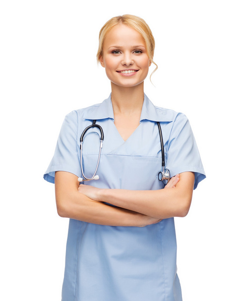 Smiling female doctor or nurse with stethoscope - Фото, зображення