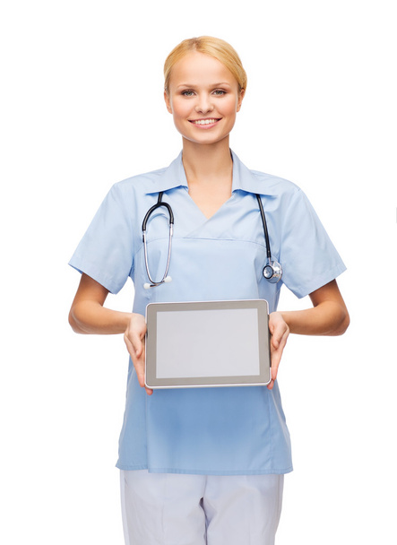 Smiling female doctor or nurse with tablet pc - Foto, Imagen