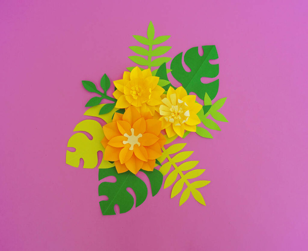 Paper craft Flower Decoration Concept. Flowers and leaves made of paper. Tropics. Pink background. - Фото, зображення