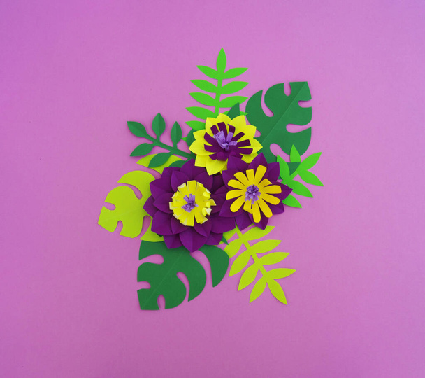 Paper craft Flower Decoration Concept. Flowers and leaves made of paper. Tropics. Pink background. - Фото, зображення