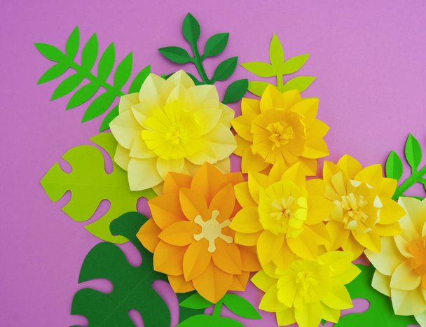 Paper craft Flower Decoration Concept. Flowers and leaves made of paper. Tropics. Pink background. - Photo, image
