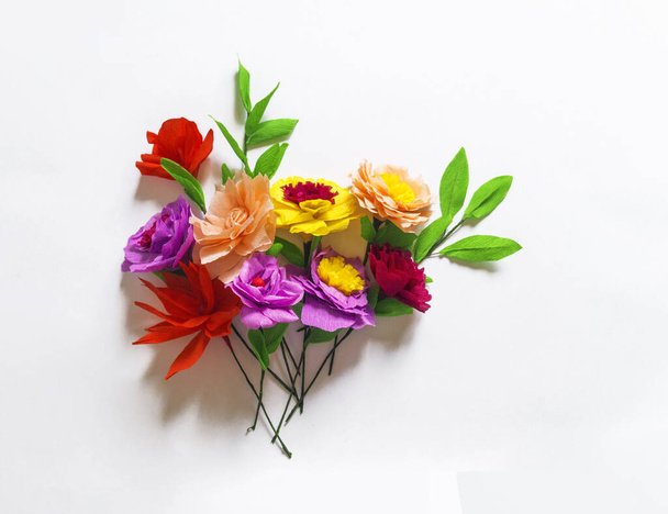 Colorful handmade flowers on a white background with copy space. Crepe paper. Master Class. St. Valentine's Day and Mother's Day. Decor for the holiday. - Foto, immagini