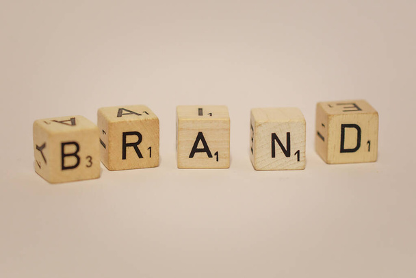 Closeup of word Brand on wooden blocks, background concept - Φωτογραφία, εικόνα
