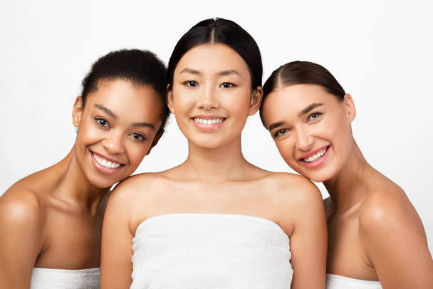 Mixed Girls Wrapped In Towels Smiling Posing In Studio - Photo, Image