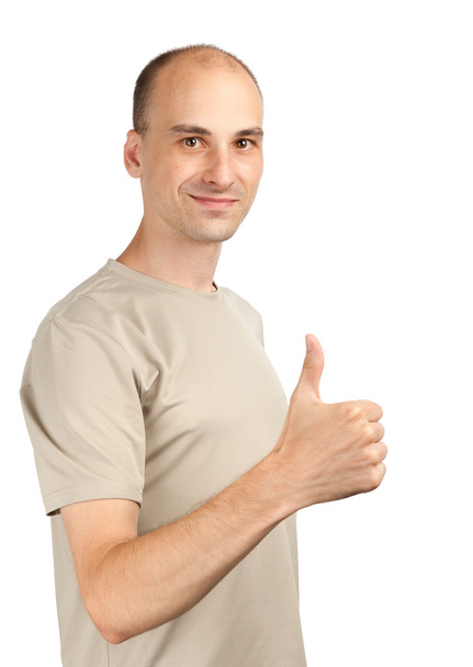 Young man with a thumb up sign - Foto, imagen