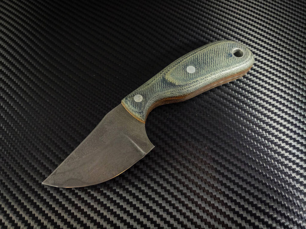 Custom hand forged knife with jeans micarta handles - Photo, Image