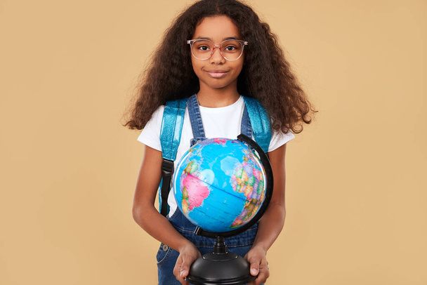 African kid with globe during lesson - Foto, Imagem