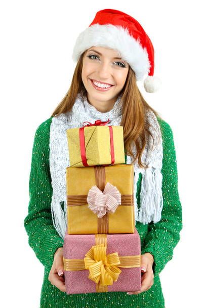 Beautiful smiling girl in New Year hat with gifts isolated on white - Photo, image