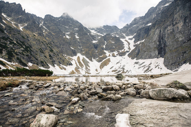 View of the lake and mountains in the Tatra National Park in Poland - 写真・画像