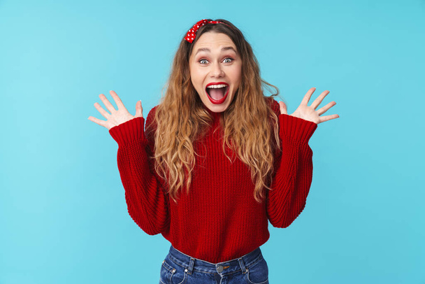 Image of happy caucasian woman in headband expressing surprise isolated over blue background - Photo, image