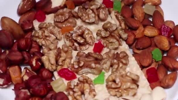 Nuts - almonds, hazelnuts, cashews and dried fruits. Healthy foods rich in minerals and vitamins. Diet and fit. Healthy lifestyle. Proper nutrition concept. - Footage, Video