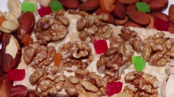 Nuts - almonds, hazelnuts, cashews and dried fruits. Healthy foods rich in minerals and vitamins. Diet and fit. Healthy lifestyle. Proper nutrition concept. - Footage, Video