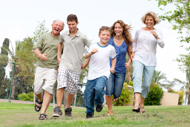 Happy family enjoying outdoors - Foto, afbeelding