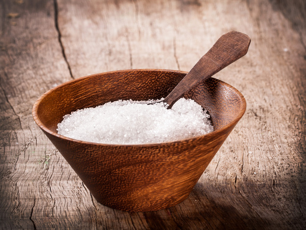 Sugar on wooden table - Фото, изображение