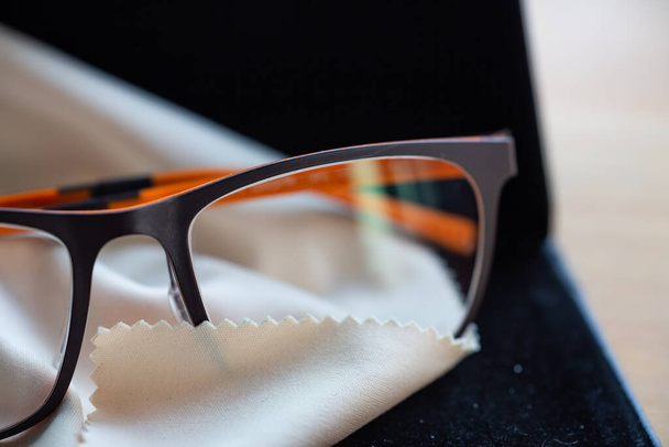 Eyeglasses with microfibre cleaning cloths, Close up & Macro shot, Selective focus - Foto, imagen