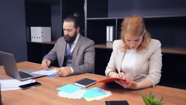 staff works with graph tables, reports in modern office - Záběry, video