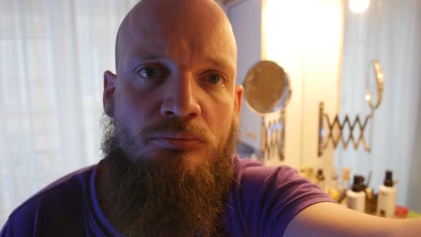 Man with disappearing moustache looking at the camera, selfie mirror style. new style without and facial hair - Záběry, video