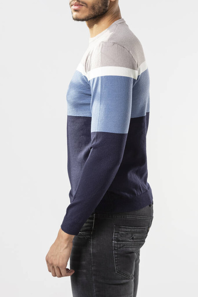 a man with a blue sweater and jeans on a white background - Fotoğraf, Görsel