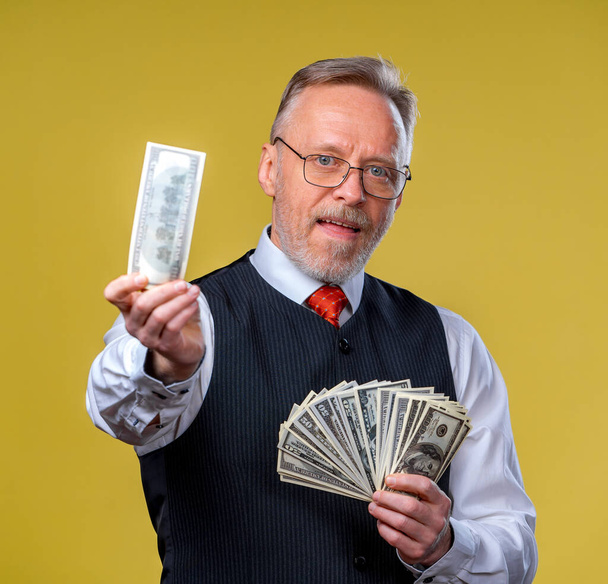 Portrait of very excited man with bunch of money. Lucky day. Human emotions and facial expressions - Photo, image