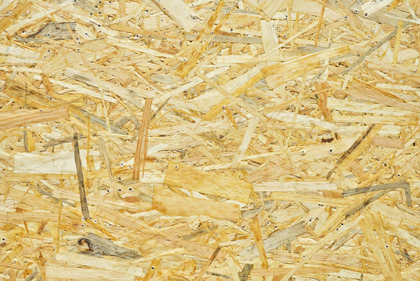 Pressed sawdust as background and texture. Close up. - Photo, Image