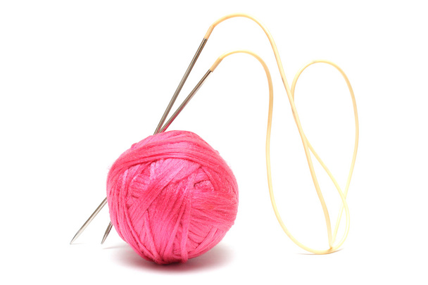 Pink clew and knitting needles isolated on white - Photo, Image