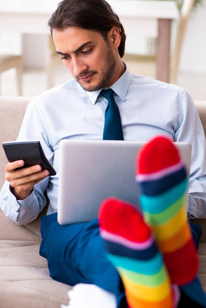 Young male businessman working at home - Photo, Image
