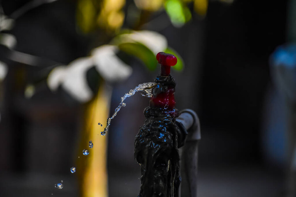 Water is coming out of the water tap. - Photo, Image