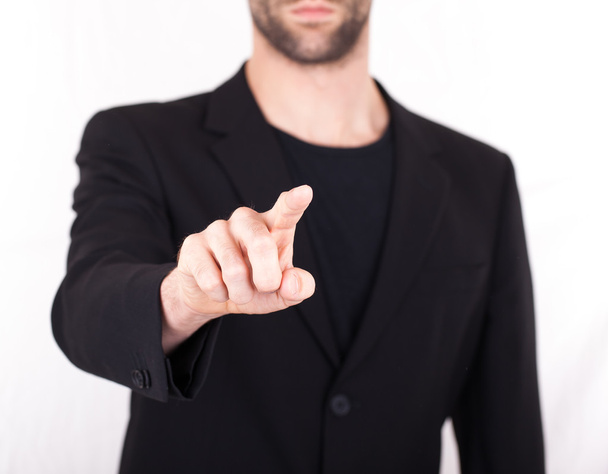 Businessman pressing an imaginary button - Foto, afbeelding