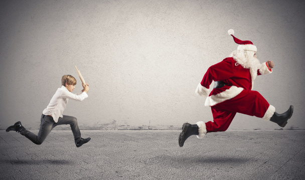 Angry child with Santa Claus - Photo, Image