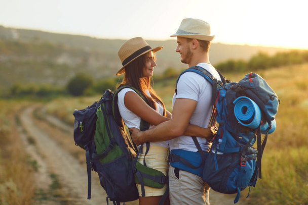 Couple hikers with backpack walking on hike in nature - Foto, Imagem